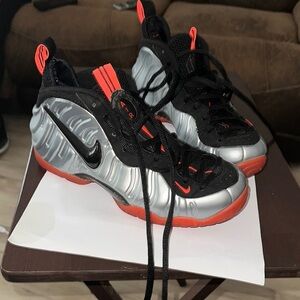 Nike Black and Red Sneakers with Silver Accents